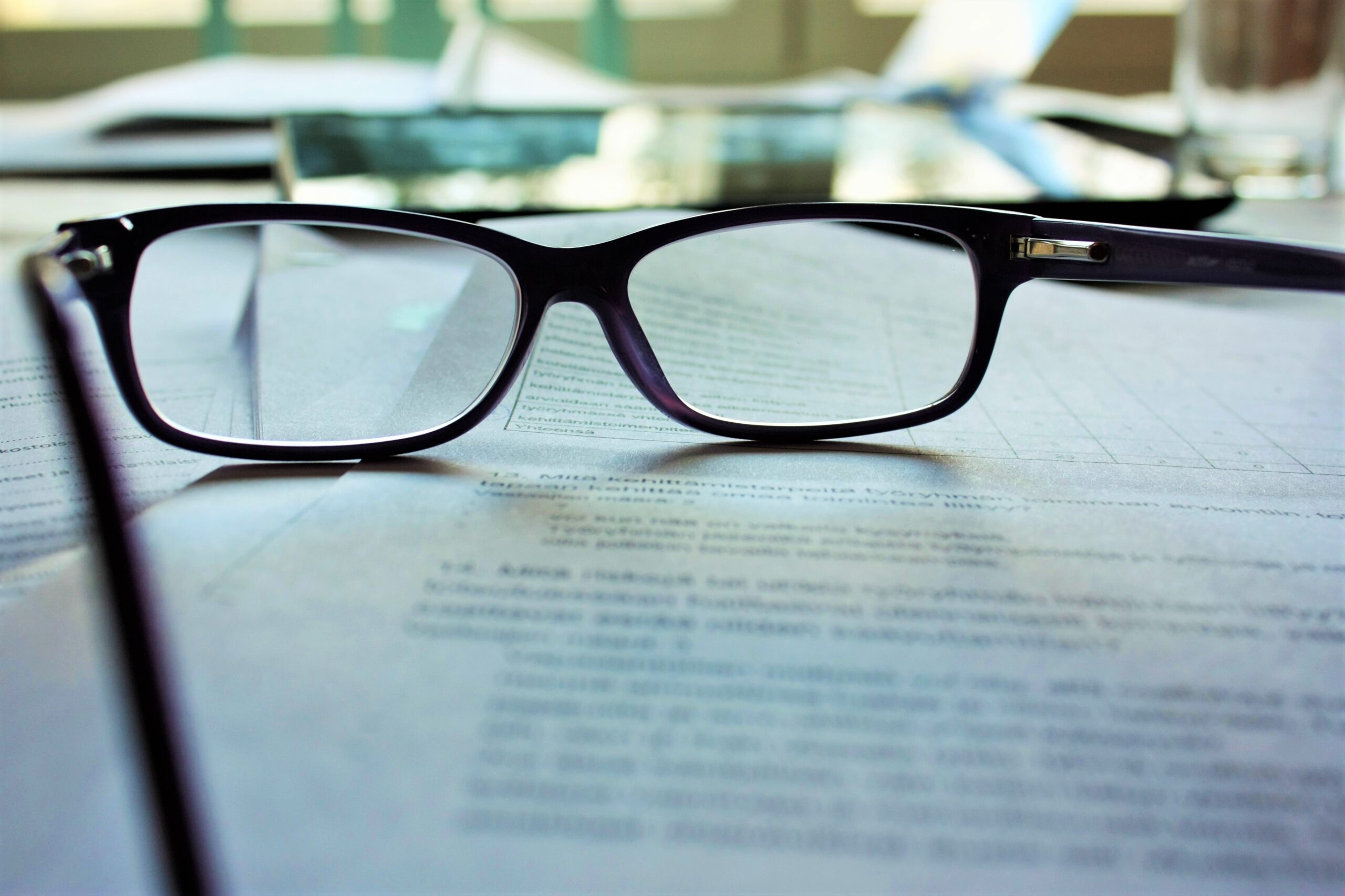 glasses on legal documents