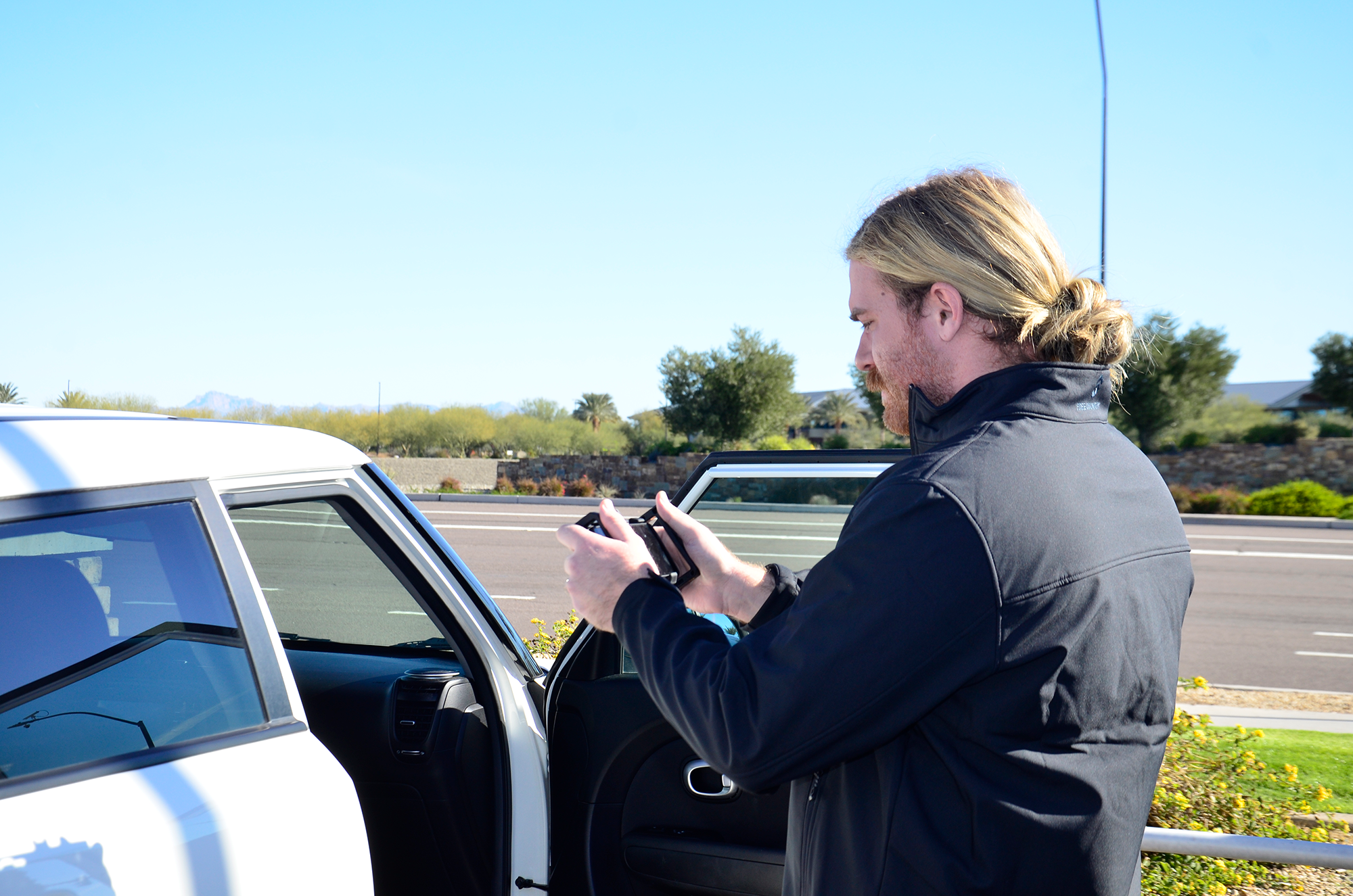 Redline photographer taking photos of new cars