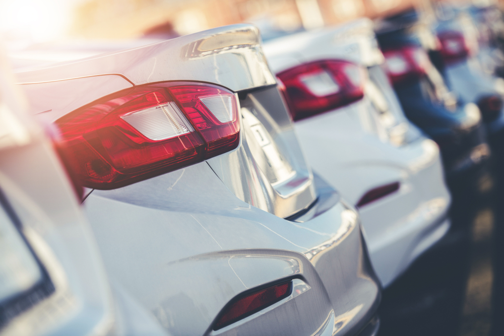 cars lined up at a dealership ready for photography
