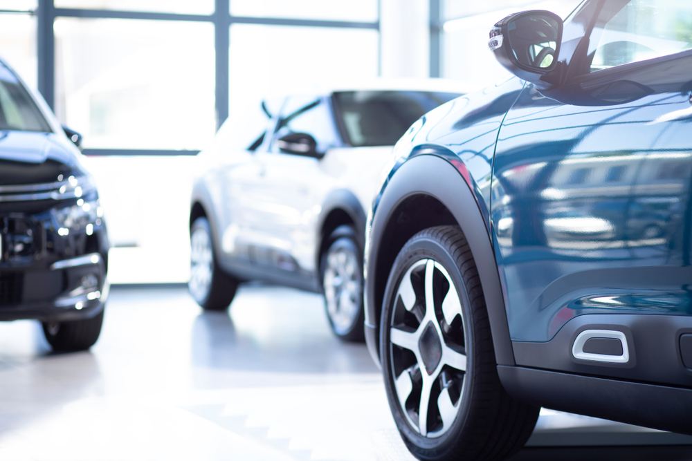dealership merchandising helping to sell cars